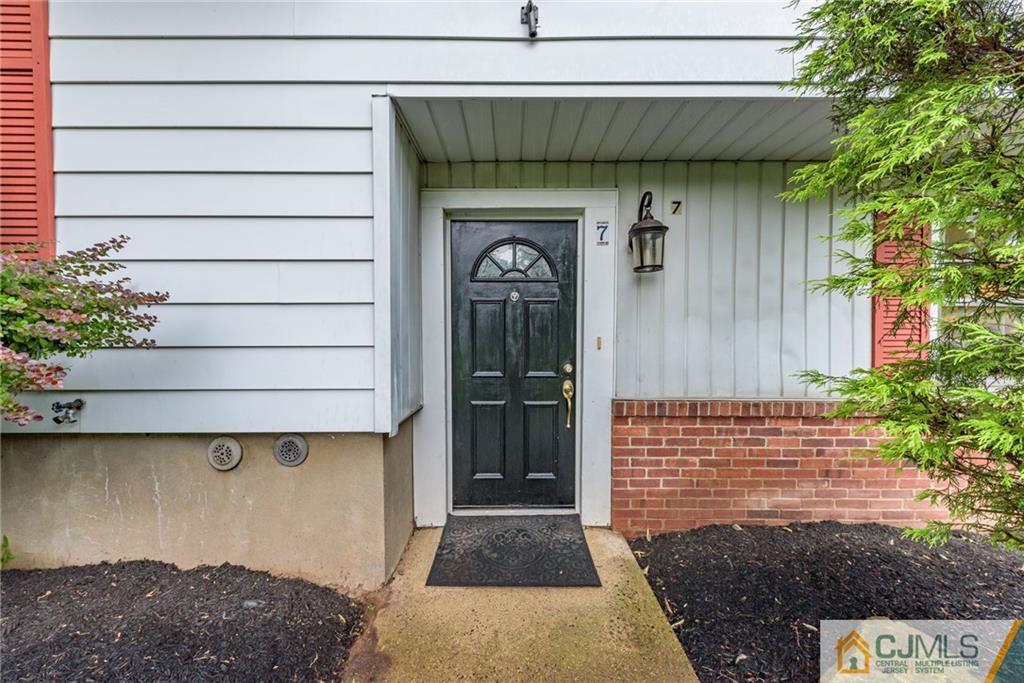 7 Bradford Road Edison, NJ 08820 - Photo 2 of 34 a front view of a house with garage