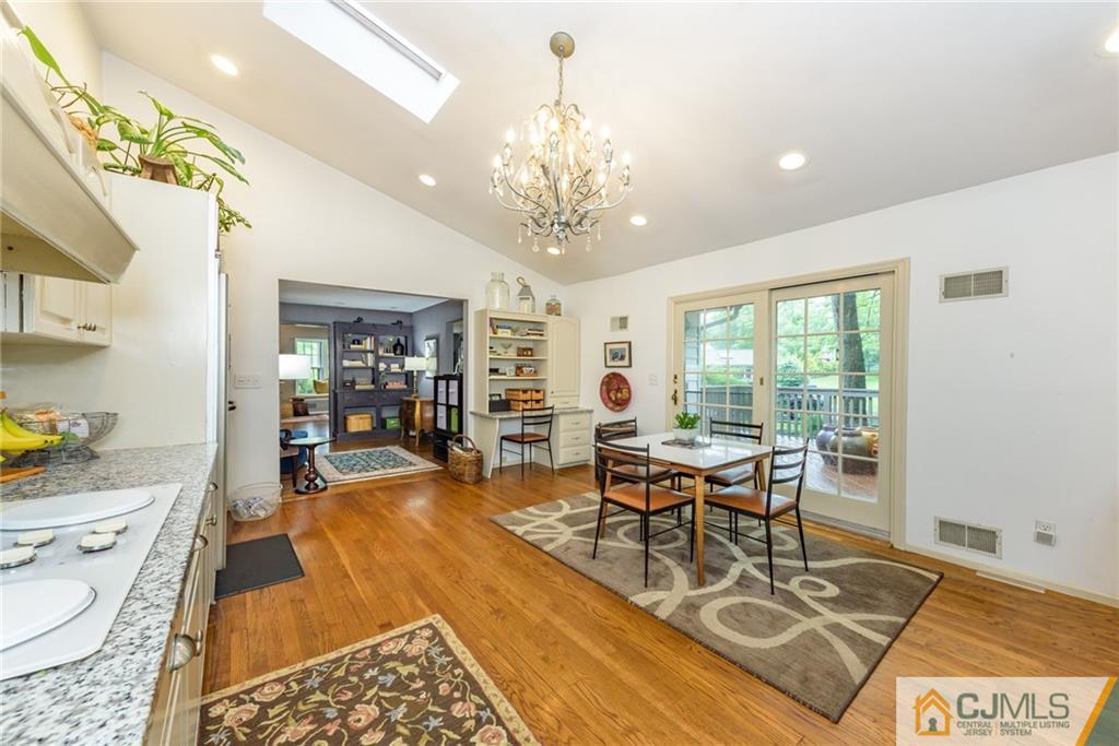 7 Bradford Road Edison, NJ 08820 - Photo 12 of 34 a living room with furniture and a chandelier