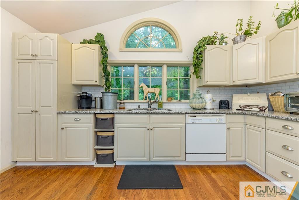 7 Bradford Road Edison, NJ 08820 - Photo 15 of 34 a kitchen with a white cabinets and sink