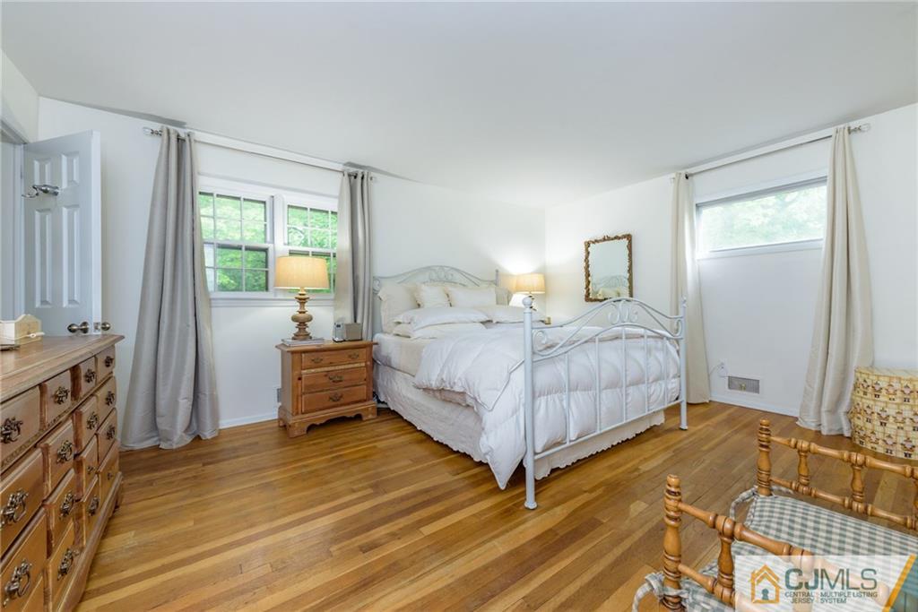 7 Bradford Road Edison, NJ 08820 - Photo 16 of 34 a bedroom with a bed and a dresser