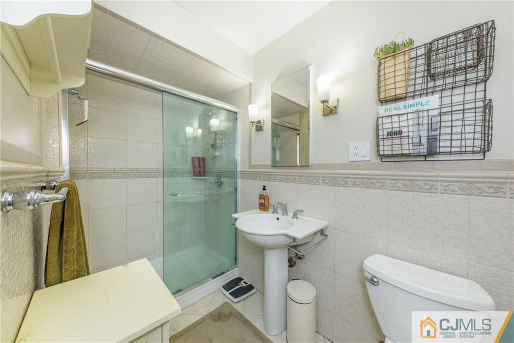 7 Bradford Road Edison, NJ 08820 - Photo 18 of 34 a bathroom with a sink toilet and shower
