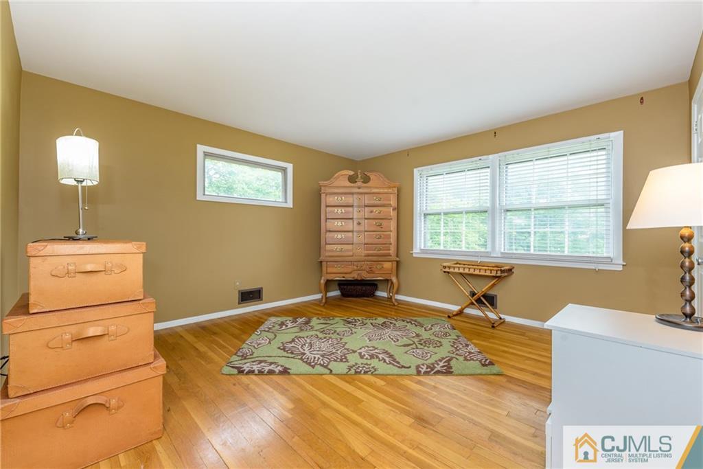 7 Bradford Road Edison, NJ 08820 - Photo 19 of 34 a bedroom with a bed and a window