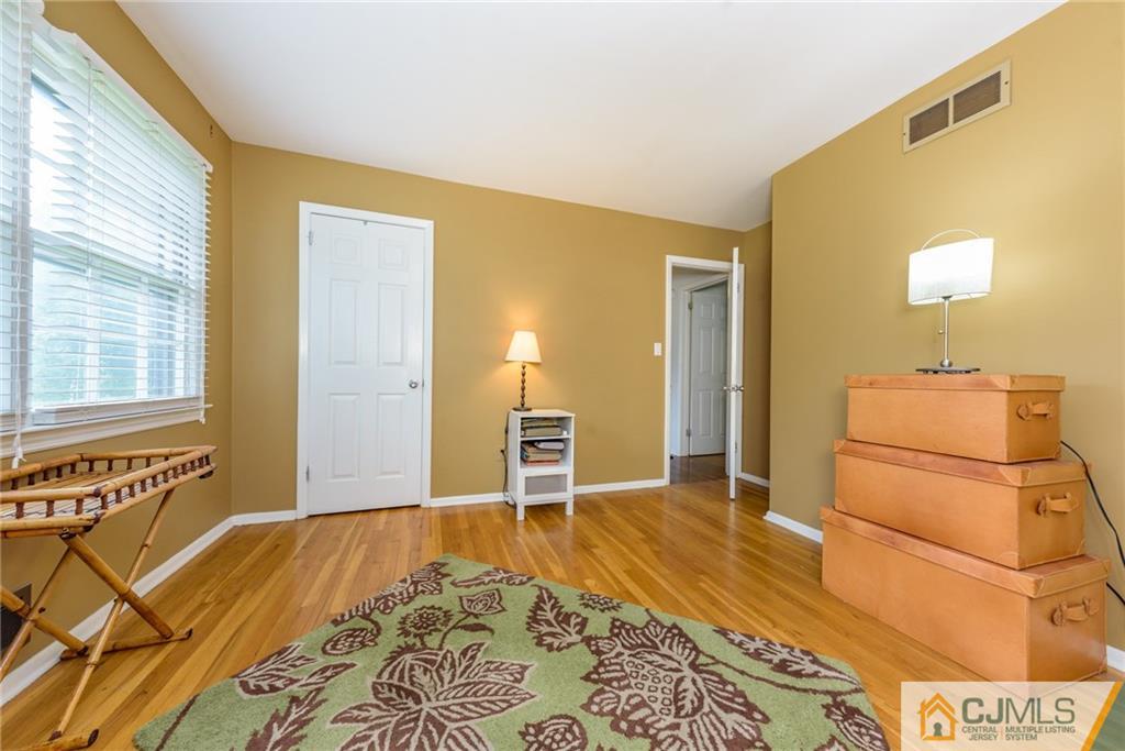 7 Bradford Road Edison, NJ 08820 - Photo 20 of 34 a bedroom with a bed and wooden floor