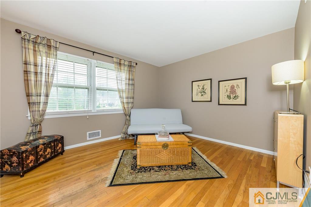 7 Bradford Road Edison, NJ 08820 - Photo 21 of 34 a living room with a rug