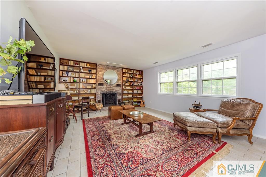 7 Bradford Road Edison, NJ 08820 - Photo 4 of 34 a living room with furniture and a potted plant
