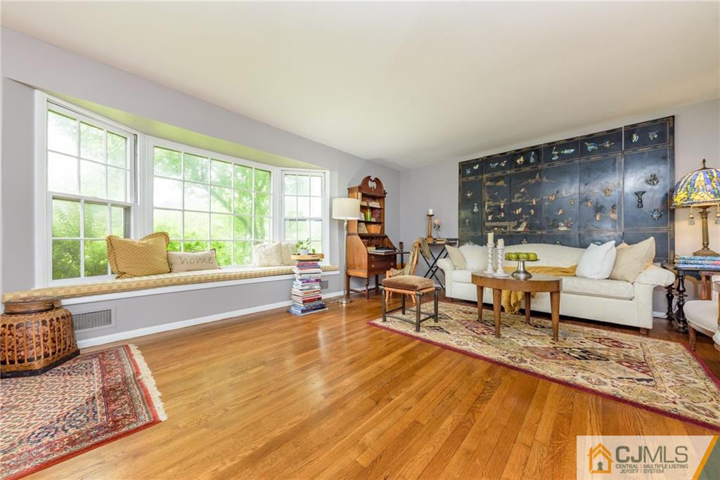7 Bradford Road Edison, NJ 08820 - Photo 6 of 34 a living room with furniture and a large window
