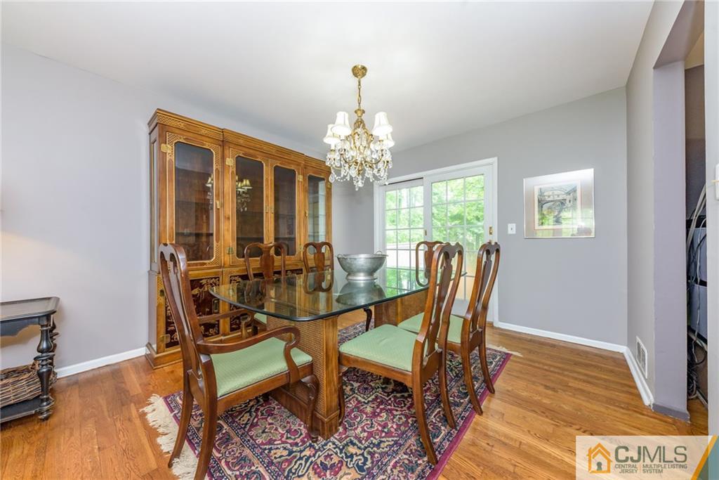 7 Bradford Road Edison, NJ 08820 - Photo 7 of 34 a view of a dining room with furniture and wooden floor
