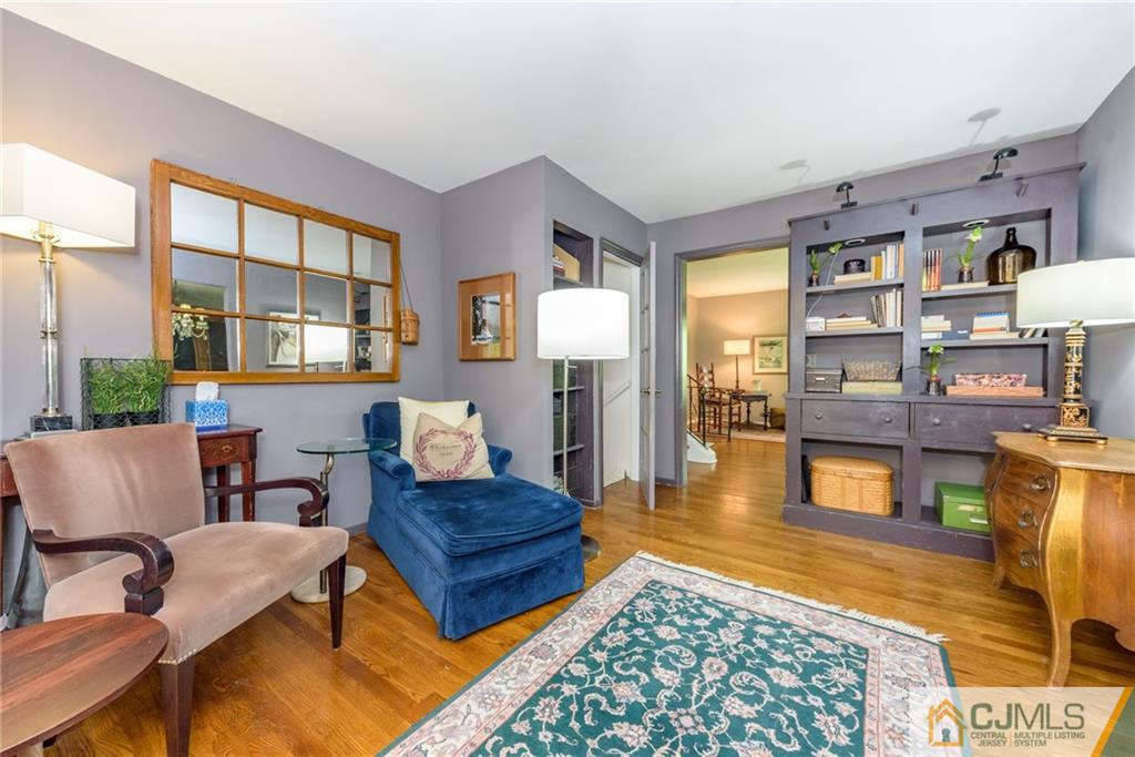 7 Bradford Road Edison, NJ 08820 - Photo 9 of 34 a living room with furniture and a floor to ceiling window or couch