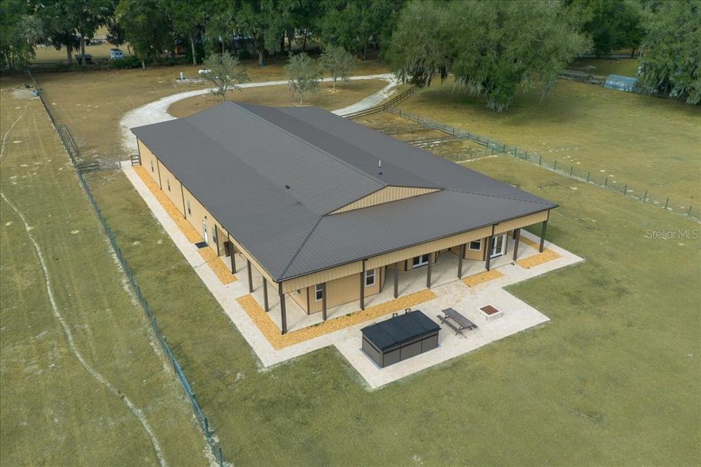 2051 Southeast 155th Street Summerfield, FL 34491 - Photo 15 of 48 a backyard of a house with chairs