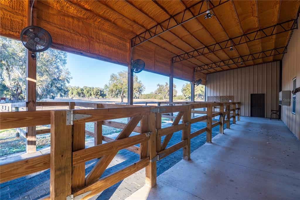 2051 Southeast 155th Street Summerfield, FL 34491 - Photo 19 of 48 a view of a chairs and table in the patio