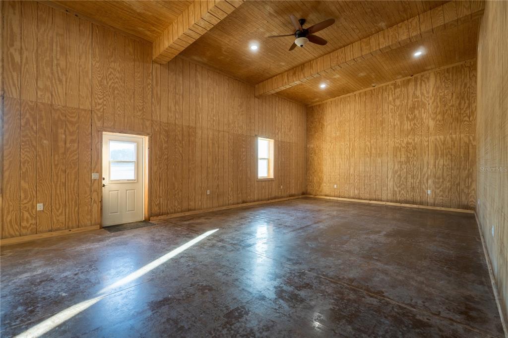 2051 Southeast 155th Street Summerfield, FL 34491 - Photo 26 of 48 an empty room with wooden floor and windows