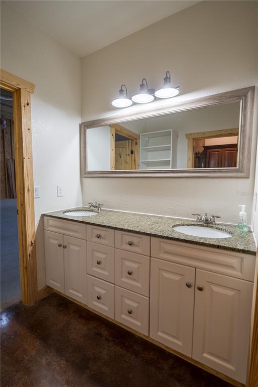 2051 Southeast 155th Street Summerfield, FL 34491 - Photo 28 of 48 a bathroom with double sink and a mirror