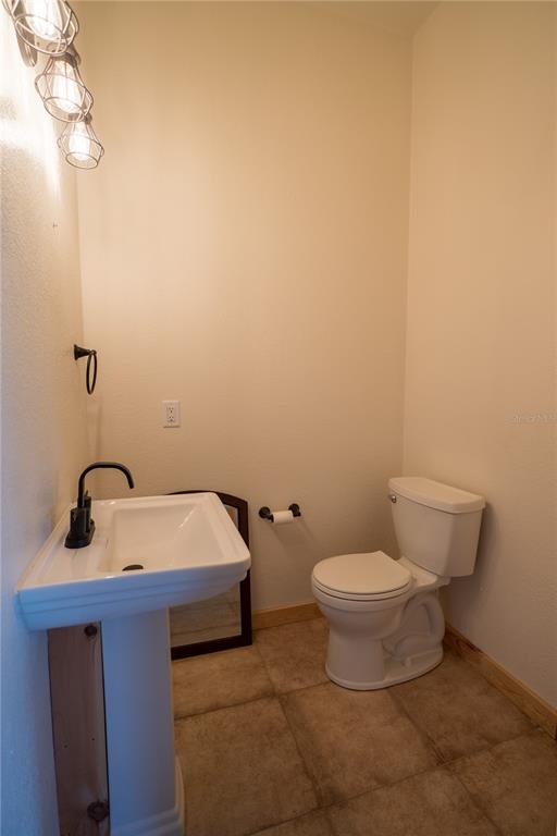 2051 Southeast 155th Street Summerfield, FL 34491 - Photo 37 of 48 a bathroom with a toilet and a sink