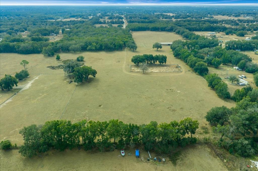 2051 Southeast 155th Street Summerfield, FL 34491 - Photo 4 of 48 an aerial view of a house with a yard and lake view