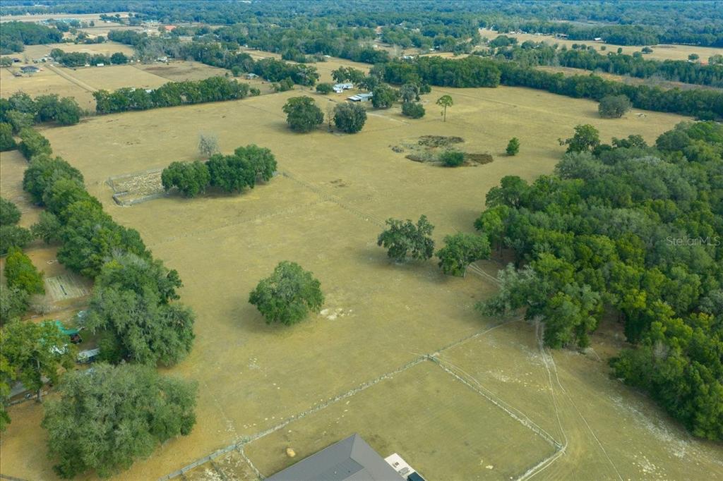 2051 Southeast 155th Street Summerfield, FL 34491 - Photo 9 of 48 an aerial view of a house with yard