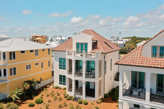 a view of multiple houses with a yard
