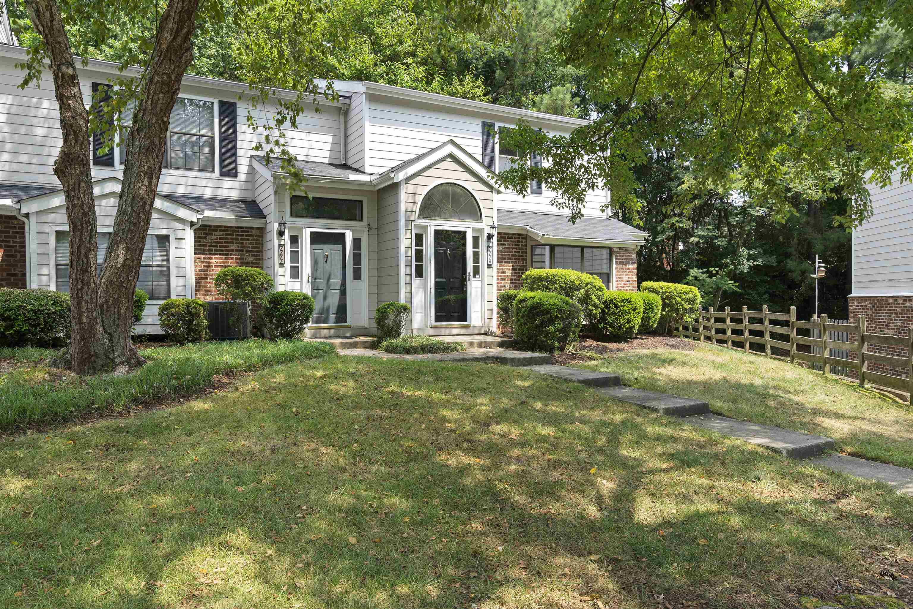 7779 Falcon Rest Circle Raleigh, NC 27615 - Photo 1 of 28 a front view of a house with garden