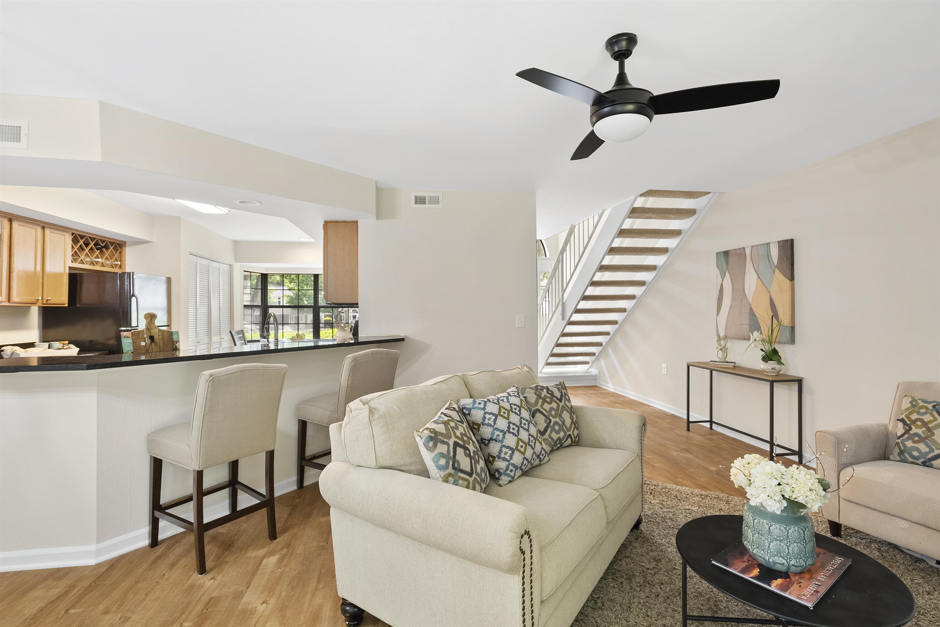 7779 Falcon Rest Circle Raleigh, NC 27615 - Photo 15 of 28 a living room with furniture and a wooden floor