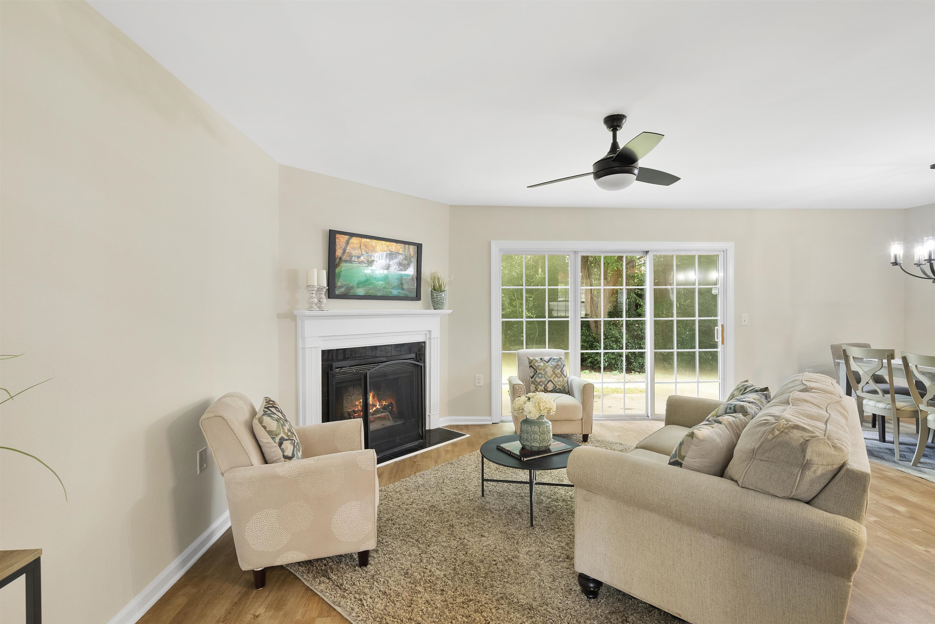 7779 Falcon Rest Circle Raleigh, NC 27615 - Photo 16 of 28 a living room with furniture and a fireplace