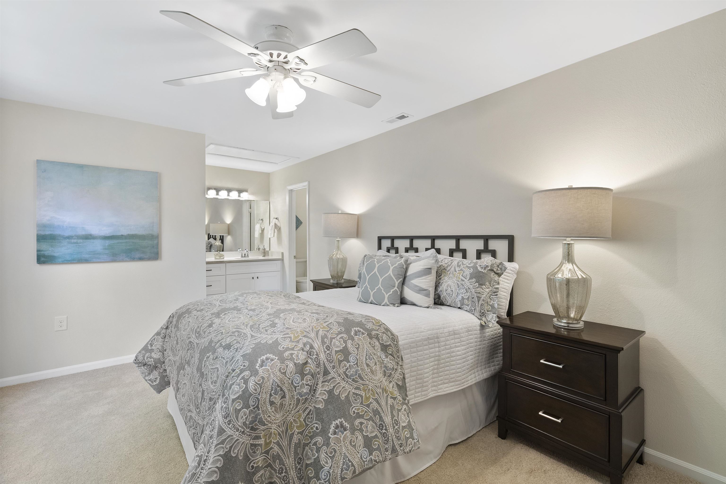 7779 Falcon Rest Circle Raleigh, NC 27615 - Photo 19 of 28 a bedroom with a bed and a night stand