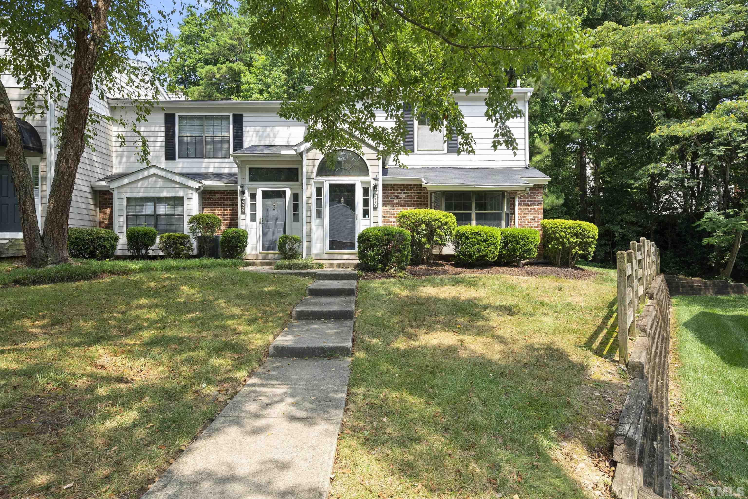 7779 Falcon Rest Circle Raleigh, NC 27615 - Photo 2 of 28 a front view of a house with a yard