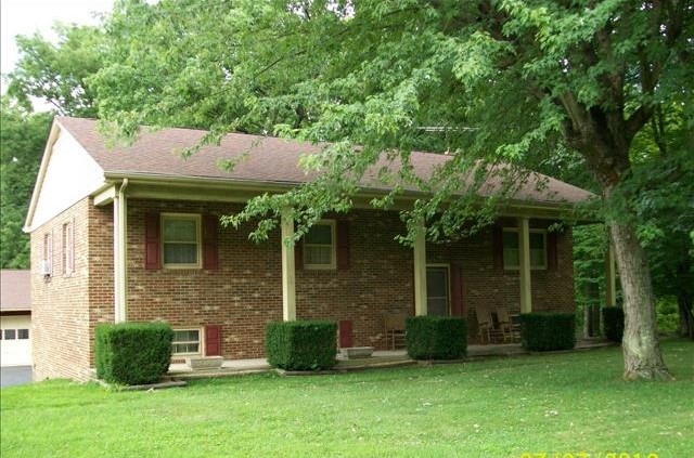 2301 Hewitt Road Swoope, VA 24479 - Photo 1 of 14 a front view of a house with a garden