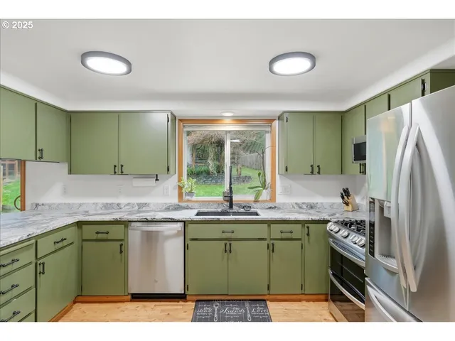 a kitchen with a sink and a refrigerator