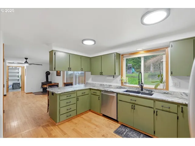 a kitchen with a sink and cabinets