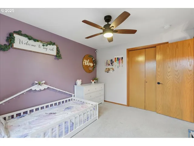 a bedroom with a bed and a dresser