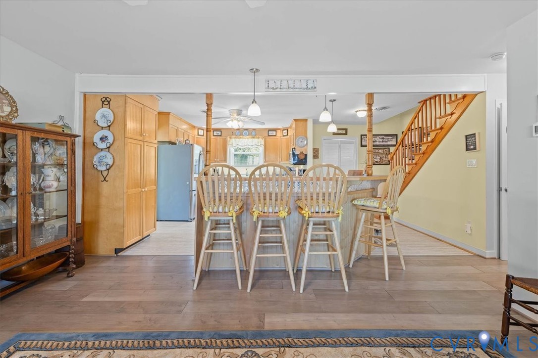 683 Villa Road Claremont, VA 23881 - Photo 12 of 28 a view of a dining room with furniture a chandelier and wooden floor