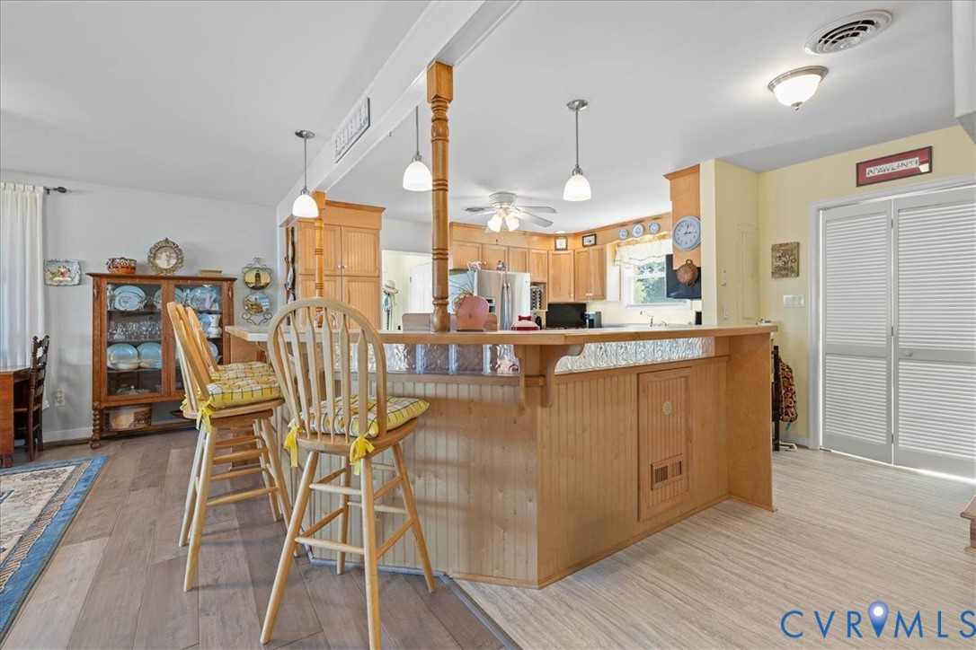 683 Villa Road Claremont, VA 23881 - Photo 13 of 28 a dining table chairs and a view of kitchen