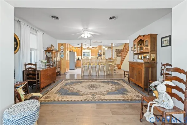 a view of a livingroom with furniture and a kitchen