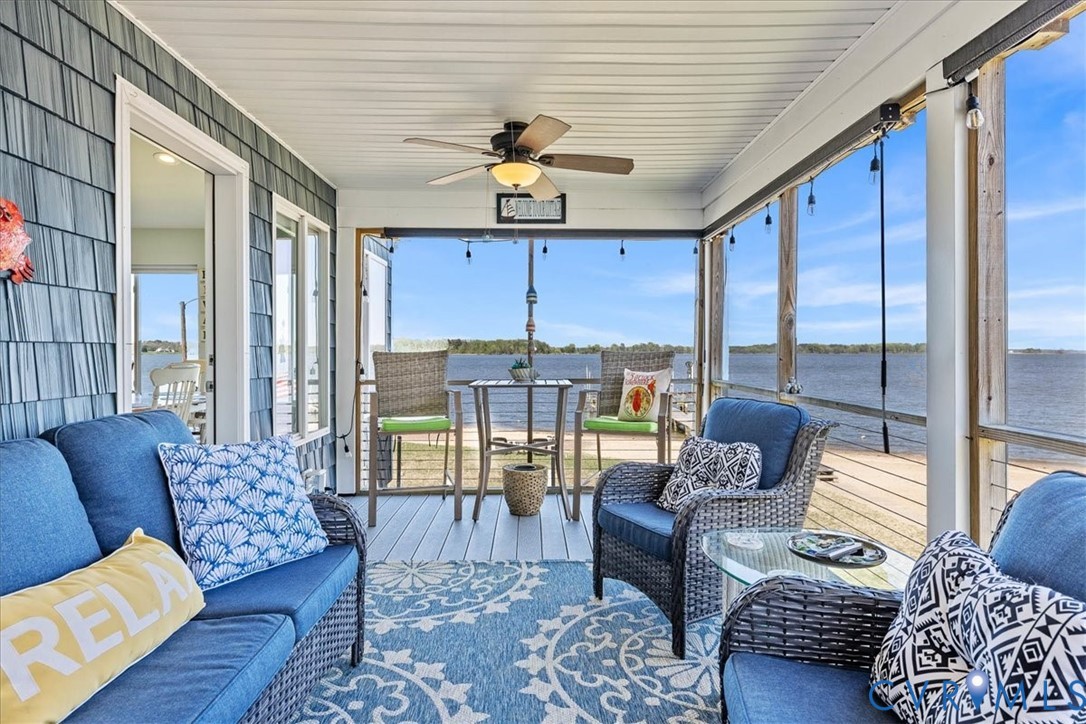 683 Villa Road Claremont, VA 23881 - Photo 17 of 28 a living room with furniture ceiling fan and a rug