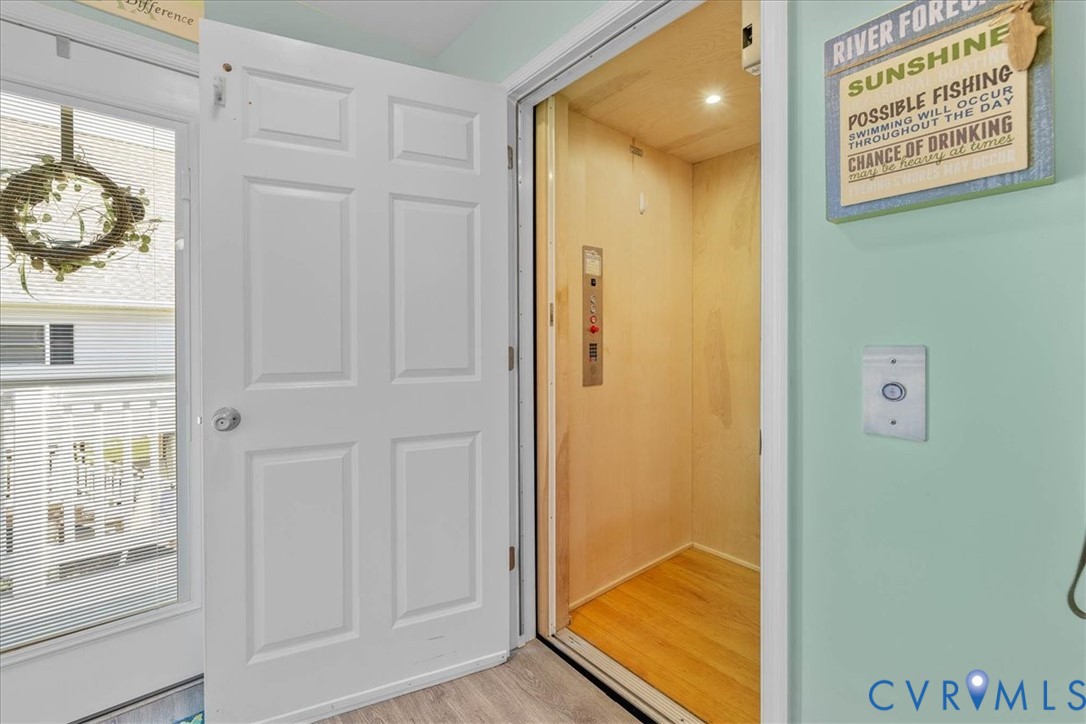 683 Villa Road Claremont, VA 23881 - Photo 8 of 28 a view of a hallway with paintings on the wall