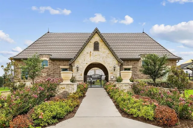 a view of a patio with table and chairs and potted plants