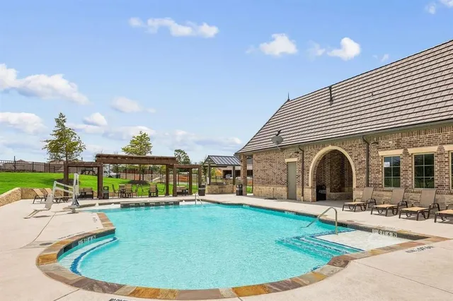 a view of a garden with a building in the background