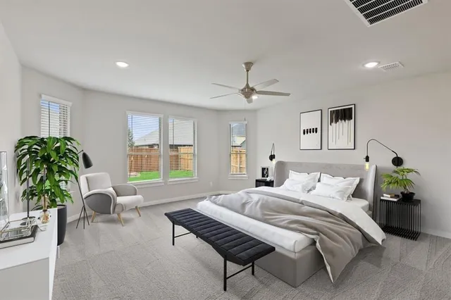 a bedroom with furniture and a potted plant