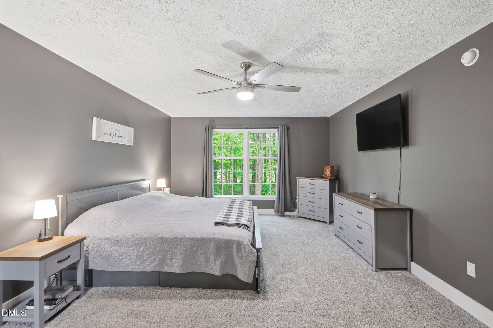 1925 Old Allensville Road Roxboro, NC 27574 - Photo 50 of 58 a bedroom with a bed and a flat screen tv