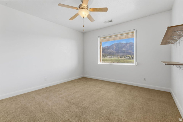 1001 Pine Valley Road Pine Valley, UT 84781 - Photo 24 of 49 Unfurnished room with light carpet and a ceiling fan