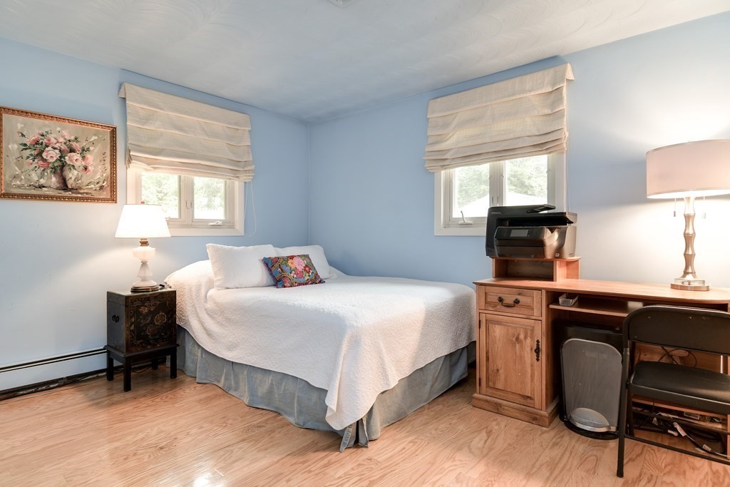 41 Lohnes Road Framingham, MA 01701 - Photo 22 of 36 a bedroom with a bed and a desk