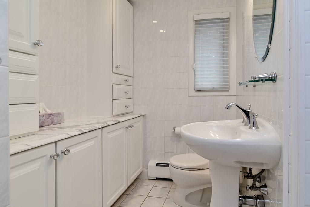 41 Lohnes Road Framingham, MA 01701 - Photo 24 of 36 a bathroom with a sink toilet and a mirror