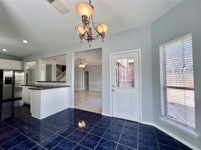 a view of an entryway with a chandelier