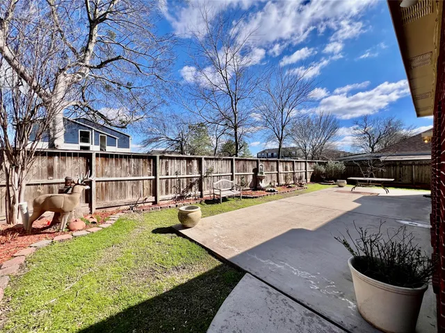 a view of swimming pool with outdoor seating and plants