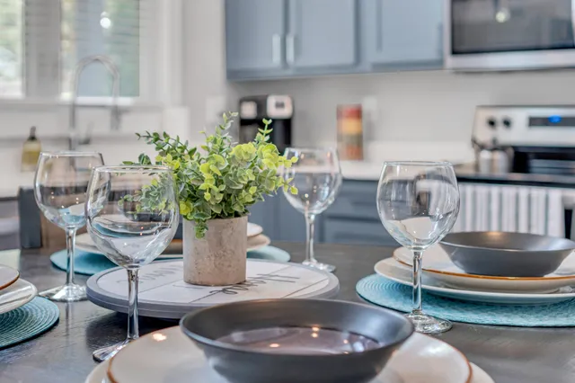 a kitchen with stainless steel appliances granite countertop a sink and cabinets