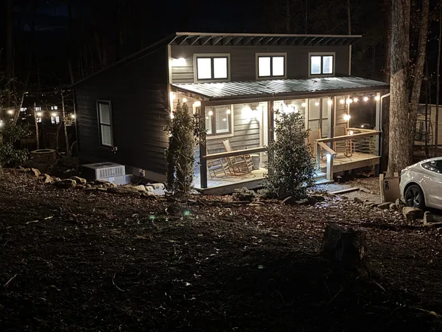 a view of a backyard with sitting area