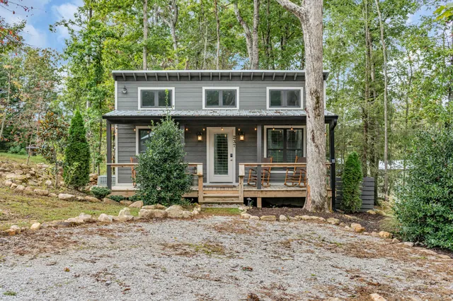 a view of a chair and tables in the garden