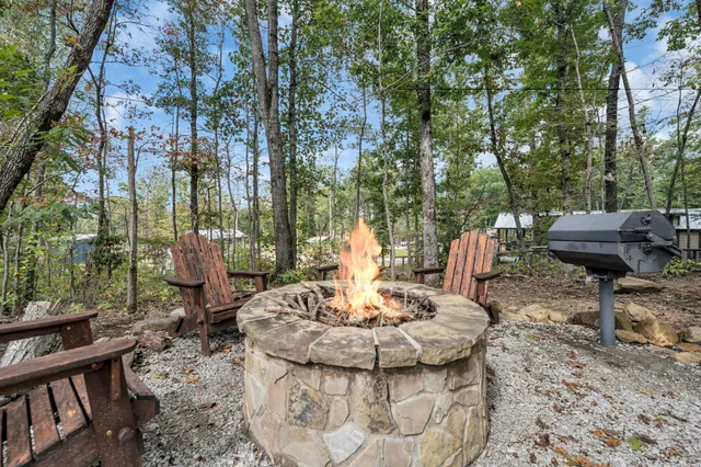 a view of a patio with table and chairs under an umbrella