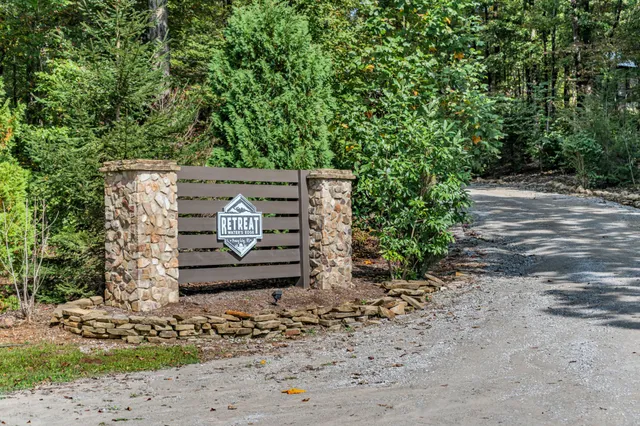 a view of a patio with table and chairs under an umbrella