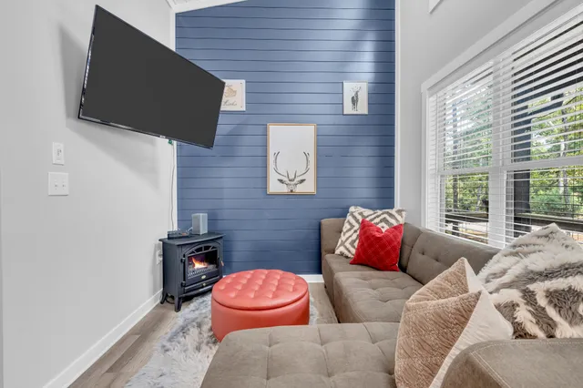 a bedroom with furniture and a book shelf