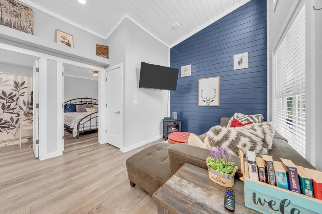 a living room with furniture and a toilet